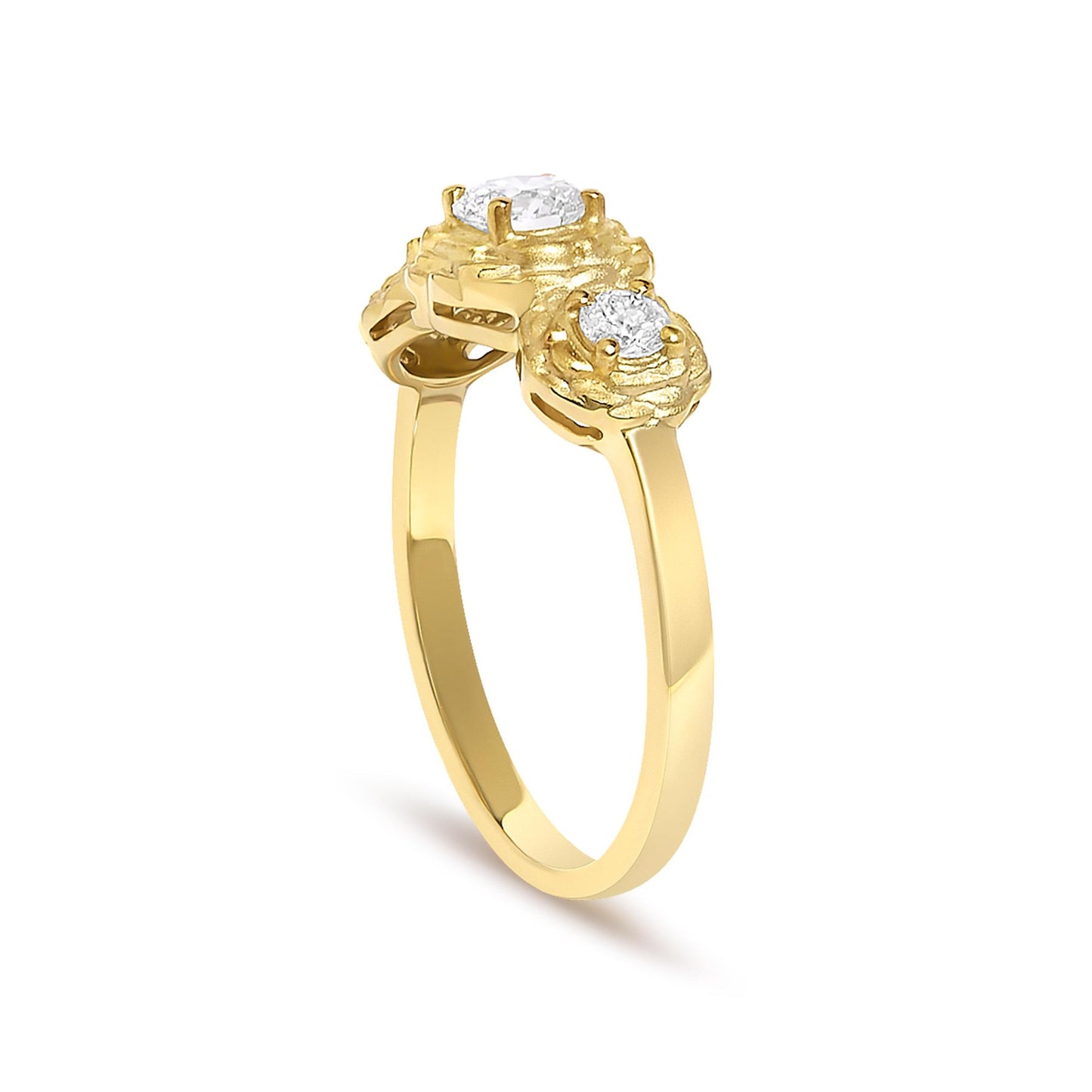 Yellow ring with a single white round gemstone in prong setting and two smaller white round gemstones in prong settings, shown from a side angle.