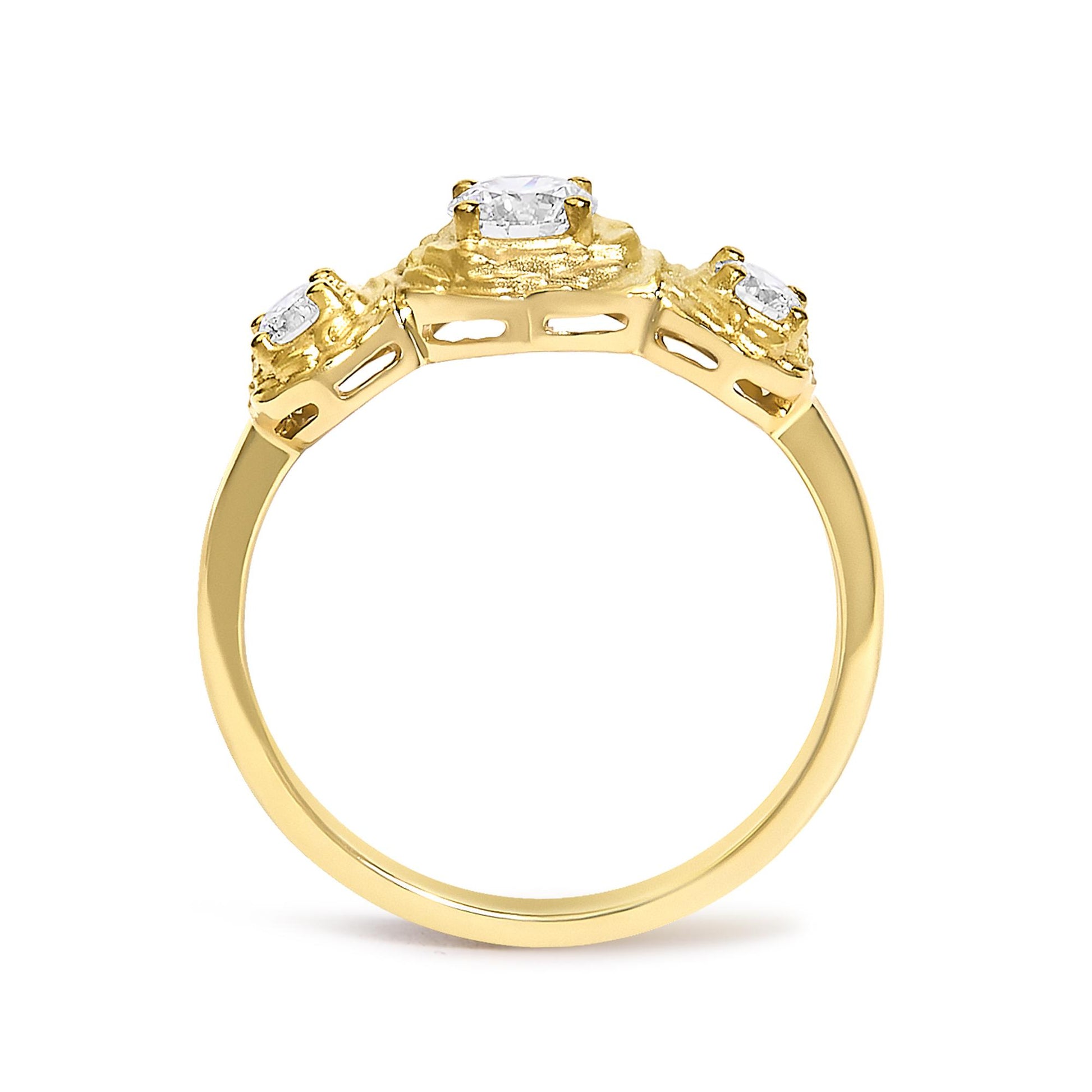 Close-up front angled view of a yellow ring featuring one round white gemstone in the center and two round white gemstones on each side in prong settings.