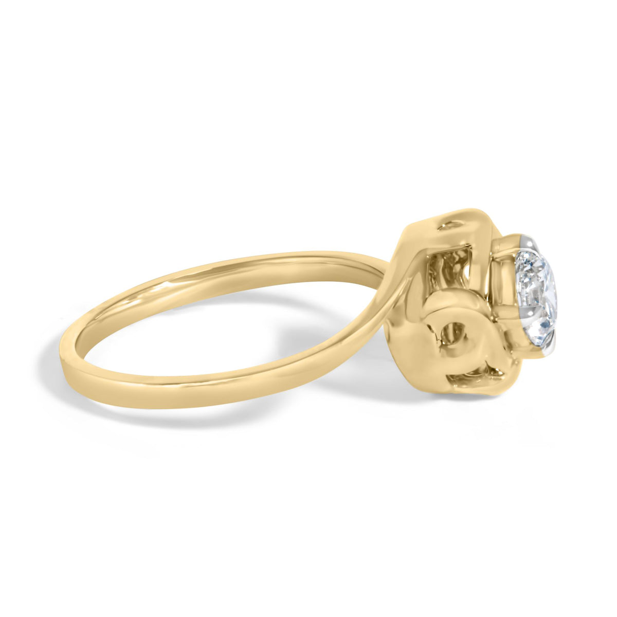 Close-up side angle of a yellow ring featuring a single round white gemstone in a prong setting.