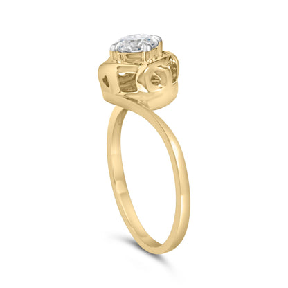 Yellow ring with a single round white gemstone in a prong setting, shown from a side angle.