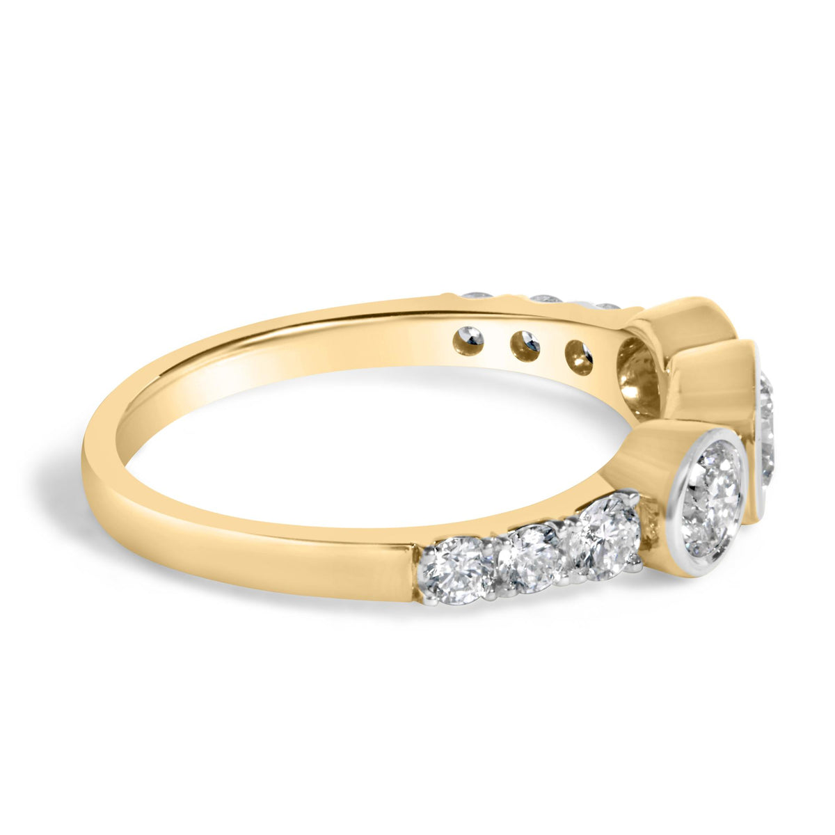 Close-up image of a yellow ring featuring multiple round white gemstones set in prong settings on the top and sides, shown at an angled side view.
