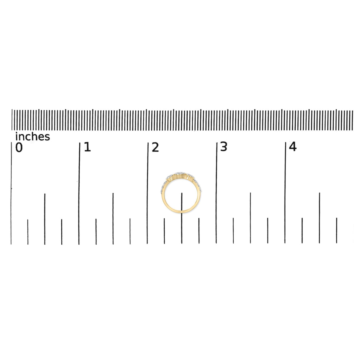 Yellow metal ring with multiple round white gemstones in prong settings along the band, shown on a scale from a top-down angle.