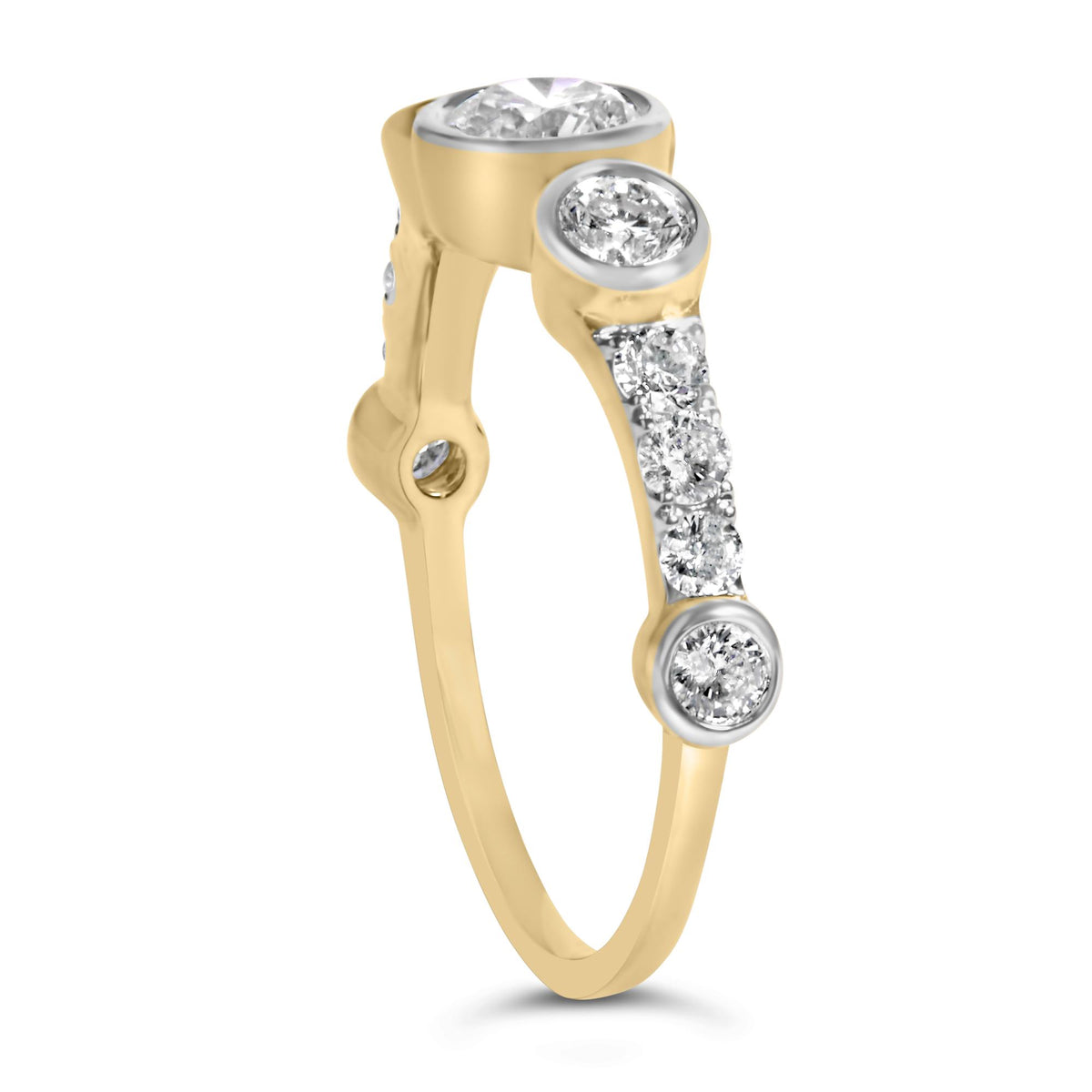 Close-up of a yellow metal ring angled upright, featuring round white gemstones in bezel and prong settings along the band and top.