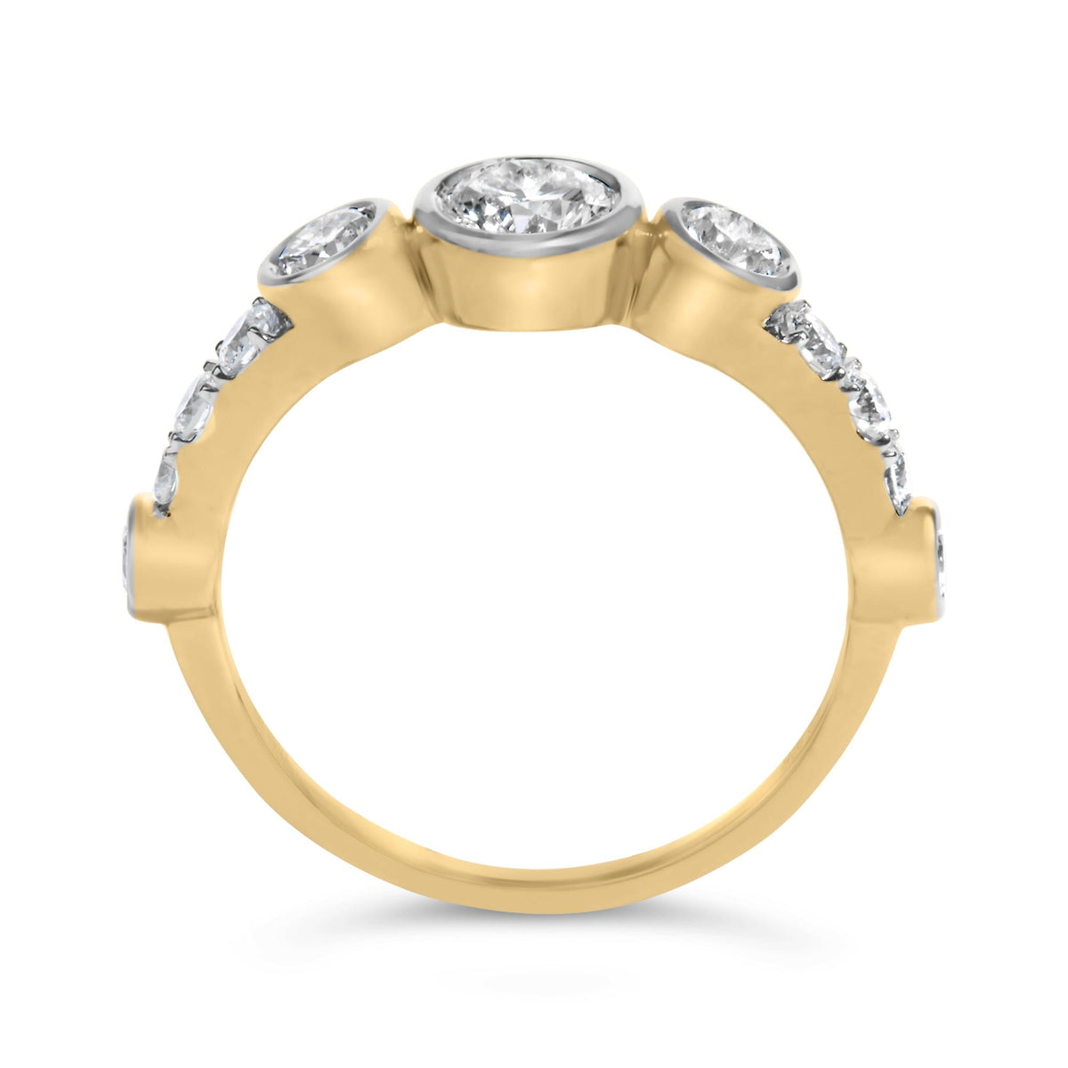 Close-up front angle of a yellow metal ring featuring a central round bezel-set white gemstone flanked by two round bezel-set white gemstones, with additional round prong-set white gemstones along the band.