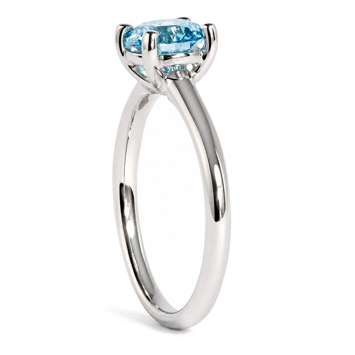 Side view of IGI certified 14K white gold solitaire ring with a round lab-grown blue fancy vivid diamond on white