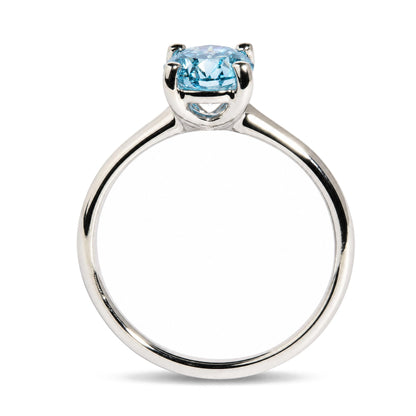 Back view of 14K white gold solitaire ring showcasing a 1.0 Cttw round lab-grown blue fancy vivid diamond on white background