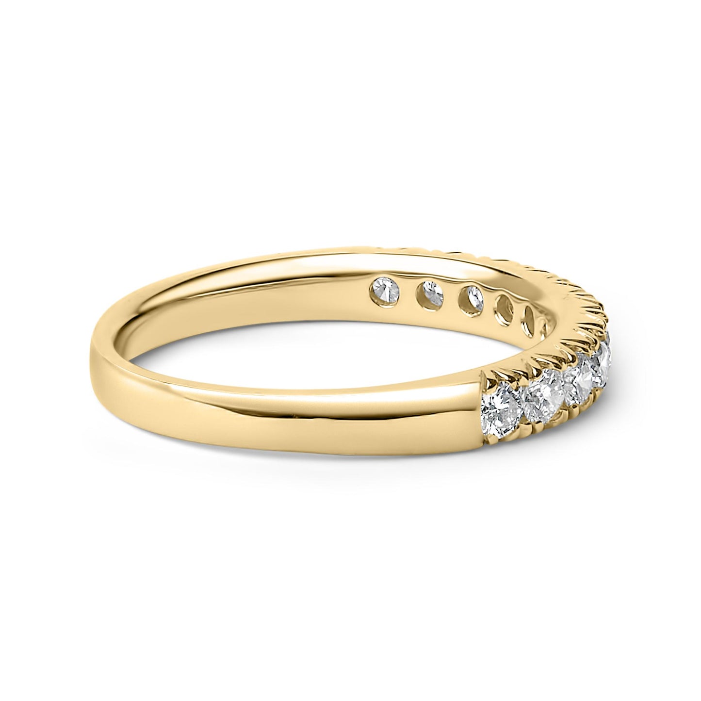 Yellow band ring with a row of round white gemstones in micro-pave setting, shown in a close-up angled side view.