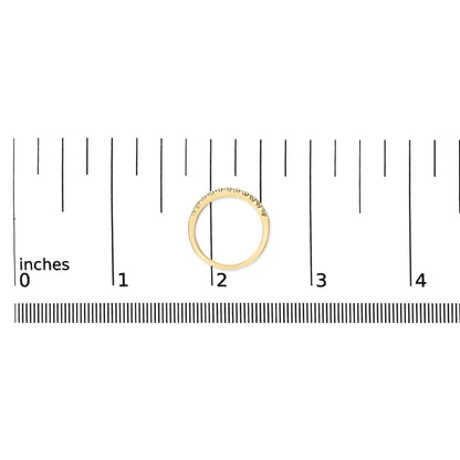 Yellow metal ring with a curved row of small white round gemstones in micro-pave setting, shown on a ruler scale, top-down view.