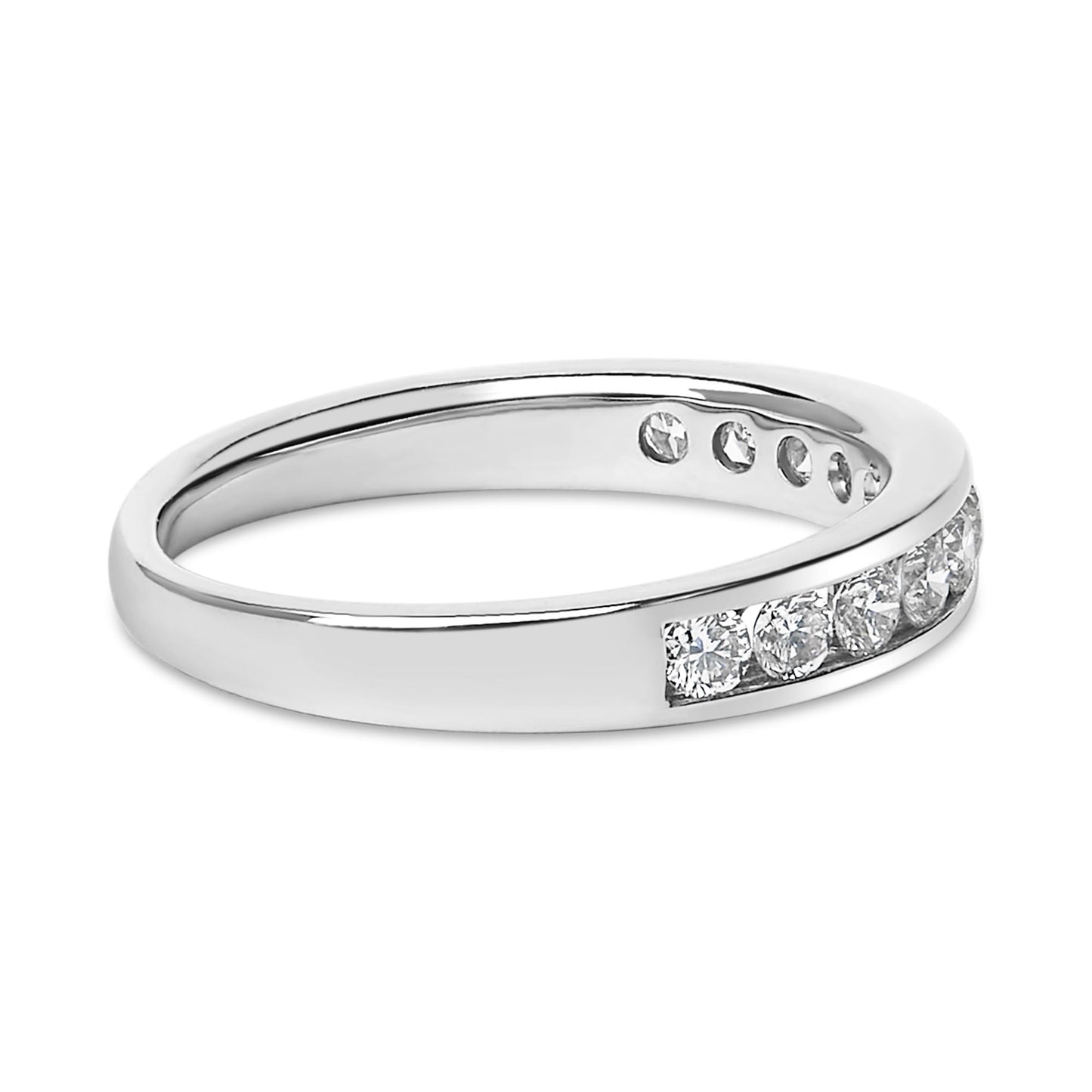 Close-up angled view of a white metal ring with round white gemstones set in a channel along the band.