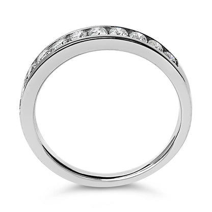 Top-down view of a white metal ring with round white gemstones set in a channel along the top half.