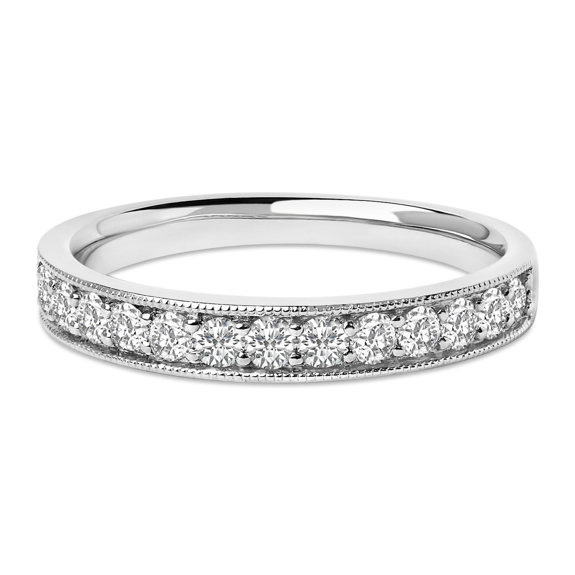 Close-up front angle of a white metal ring with a row of round white gemstones in a micro-pave setting around the band.