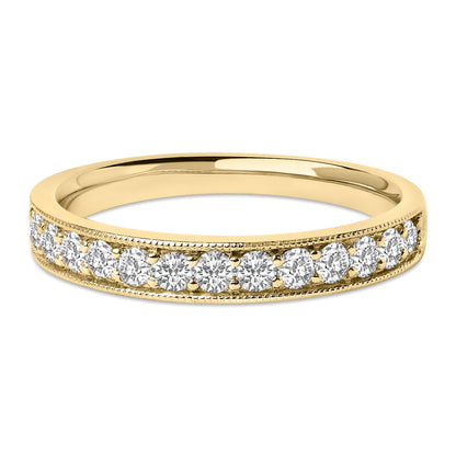 Close-up front angle of a yellow metal ring with a row of round white gemstones in a micro-pave setting along the band.