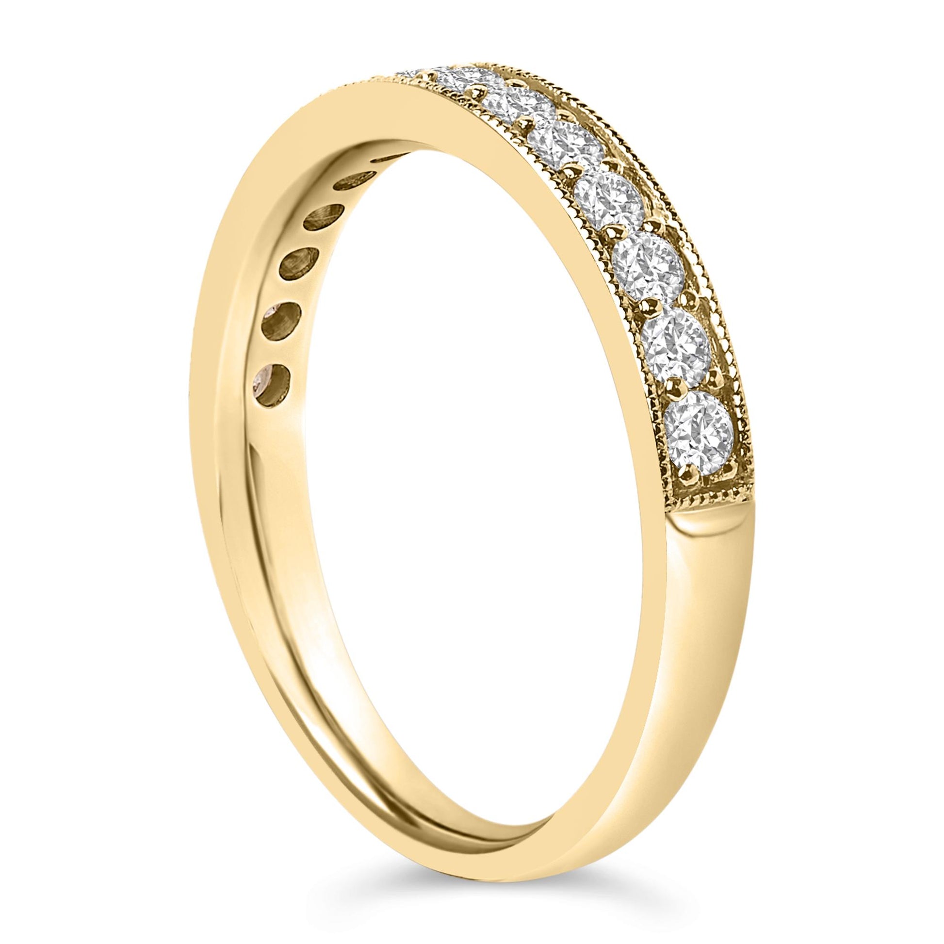 Close-up angled view of a yellow ring featuring a row of white round gemstones in a micro-pave setting along the upper band.
