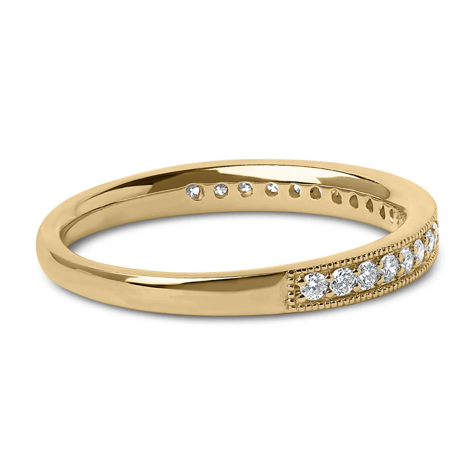Close-up angled view of a yellow metal ring featuring a row of small round white gemstones in a micro-pave setting along the band.