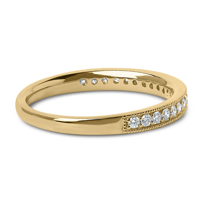 Close-up angled view of a yellow metal ring featuring a row of small round white gemstones in a micro-pave setting along the band.