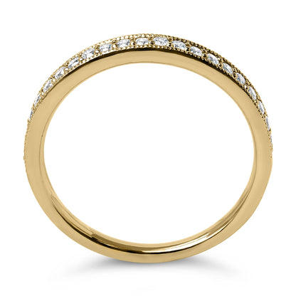 Close-up front view of a yellow metal ring featuring a row of small round white gemstones in a micro-pave setting along the top half.