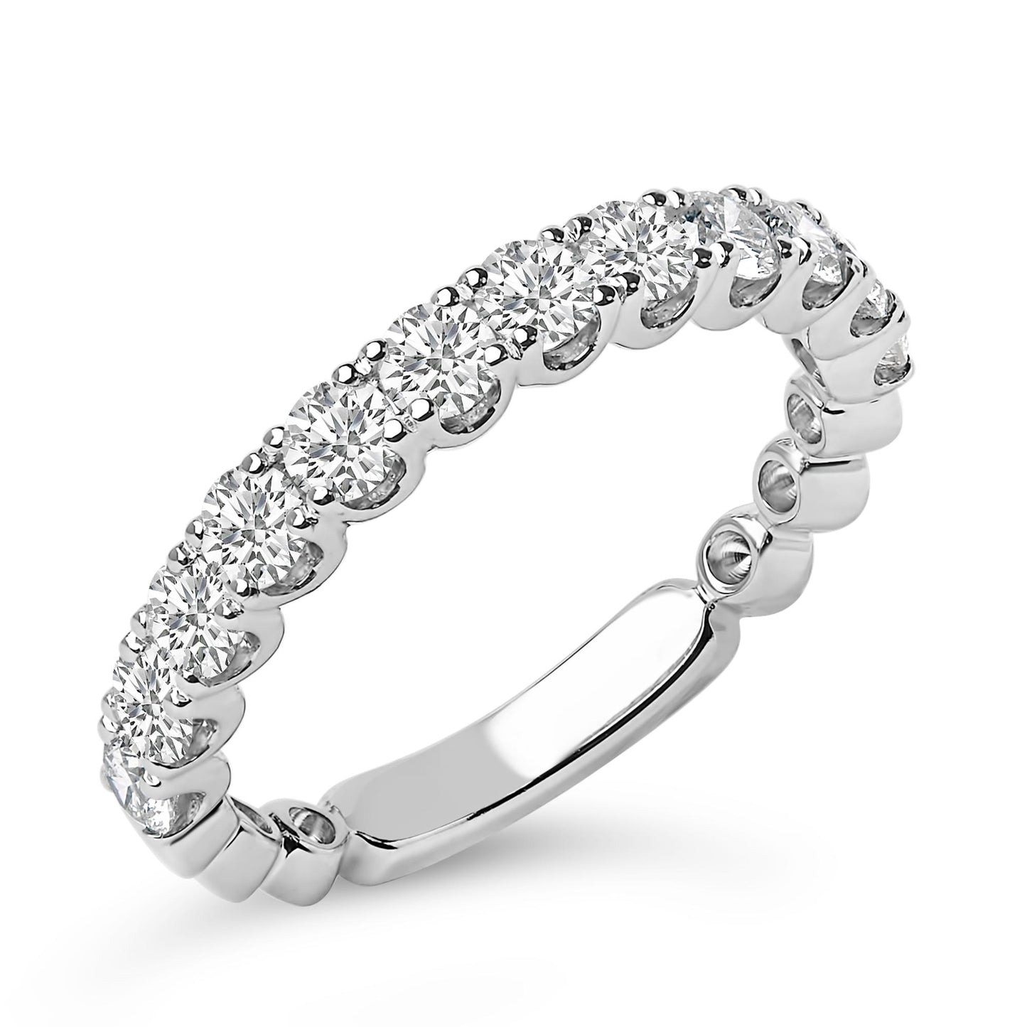 Close-up angled image of a white metal ring featuring a continuous row of round white gemstones in 4-prong settings around the band.
