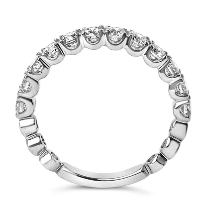 White metal ring with a continuous row of round white gemstones in 4-prong settings, shown in a close-up front-facing angle.