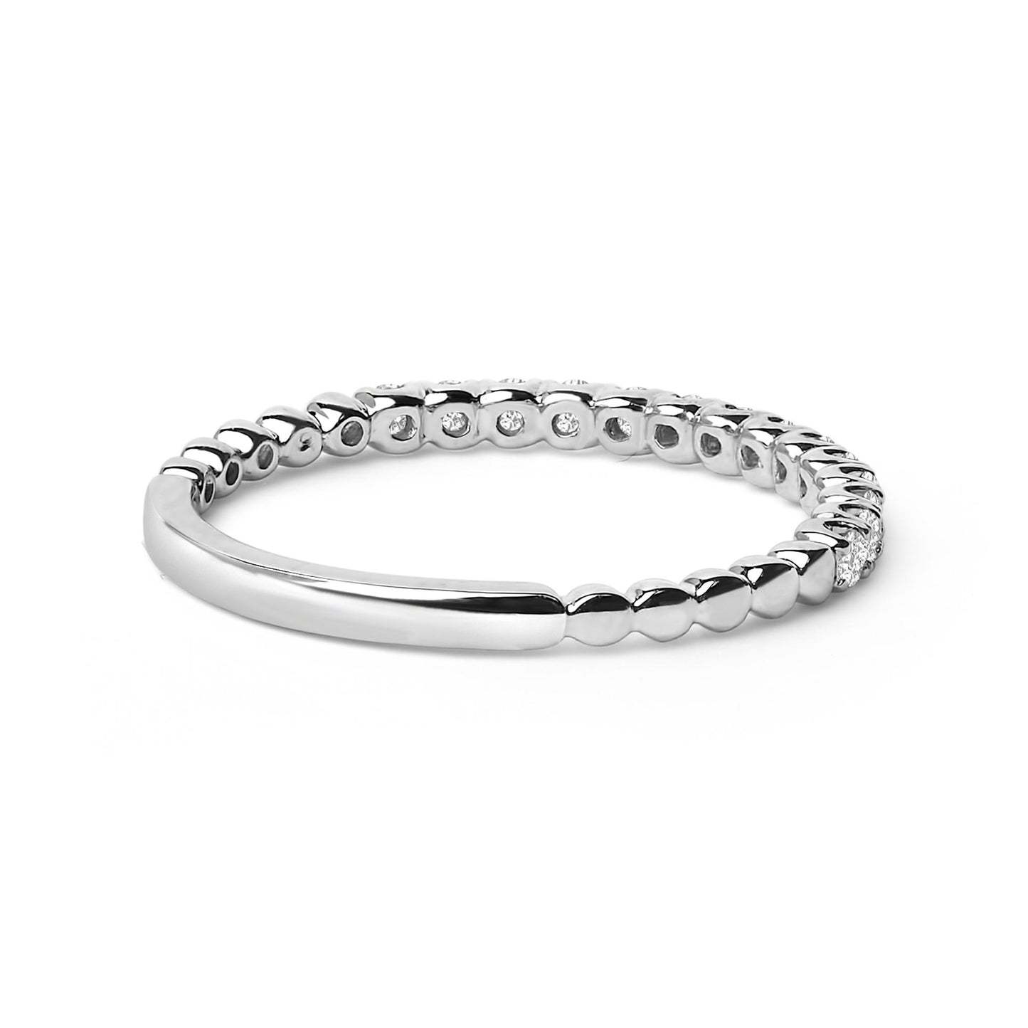 Close-up side angle of a white ring featuring a smooth band transitioning into a beaded design with round white gemstones in prong settings along part of the band.