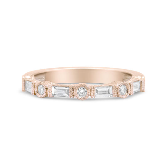 Front-facing view of a rose-colored ring featuring alternating bezel-set round white gemstones and invisibly-set baguette-shaped white gemstones.