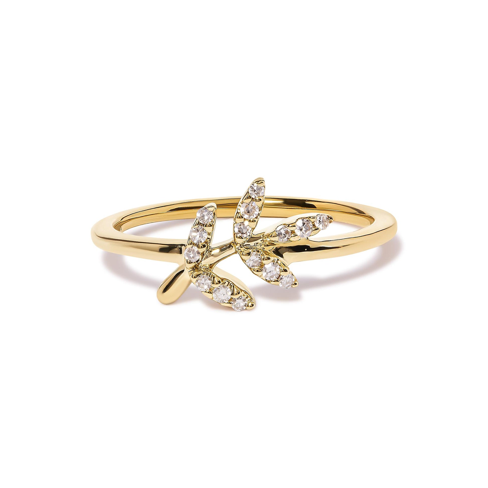 Close-up front angle of a yellow ring featuring two branches adorned with round white gemstones in pave setting.