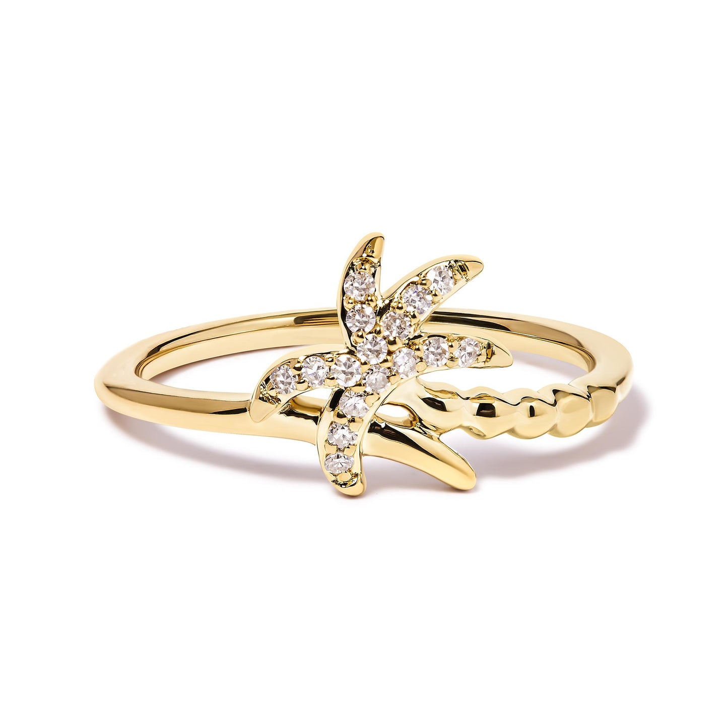 Yellow metal ring with star-shaped design adorned with round white gemstones in pave setting, shown in a close-up angled view on a white background.