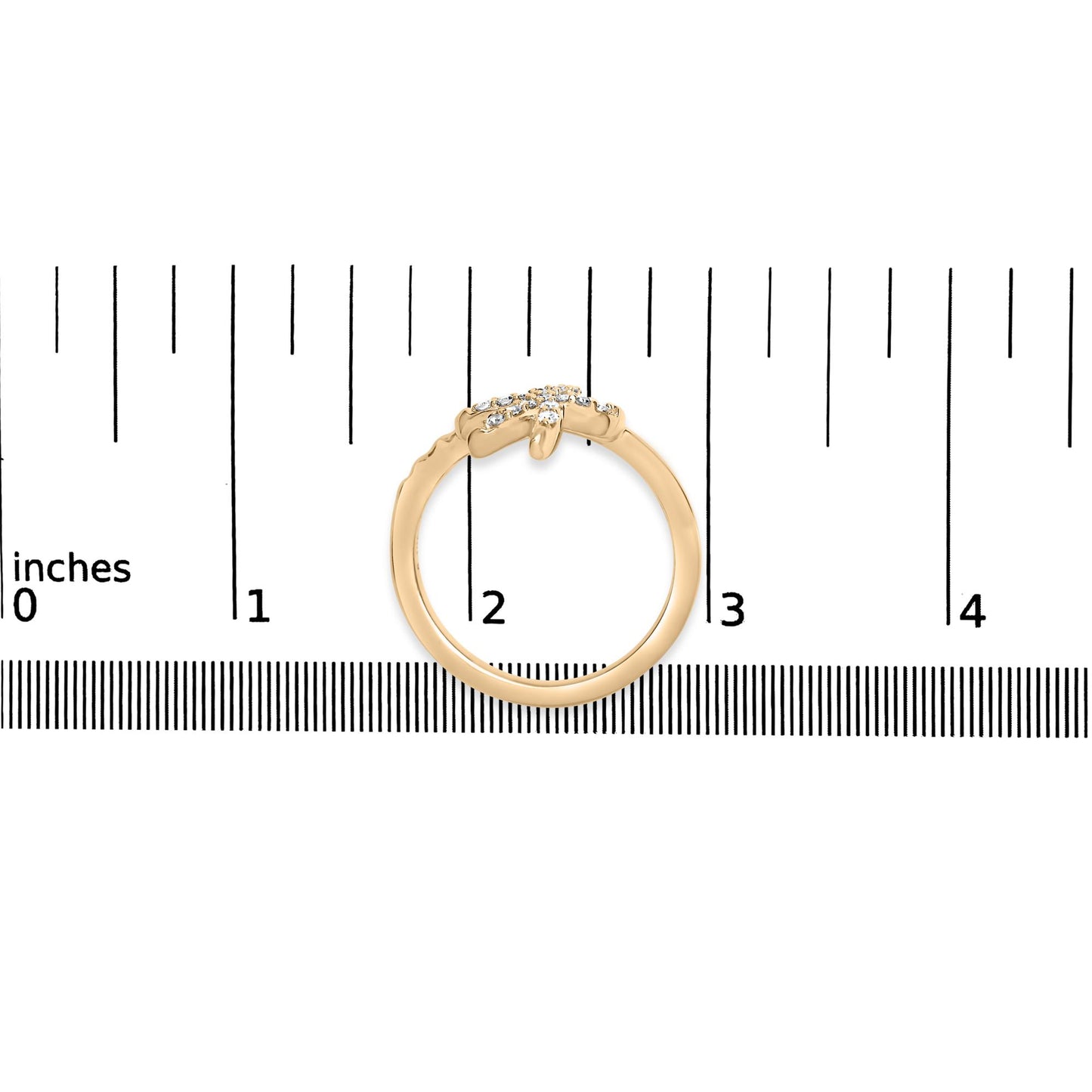 Yellow ring with pave set round white gemstones, shown from the front on a ruler for size reference.