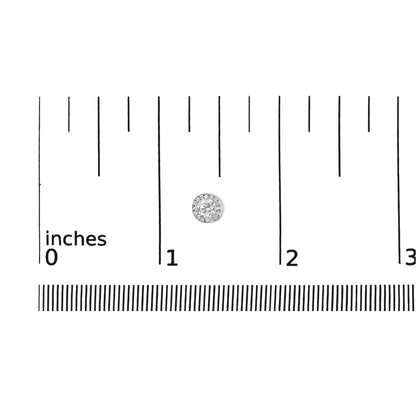 Single white metal round earring with small and channel set white gemstones, shown on ruler for size reference, top-down angle.