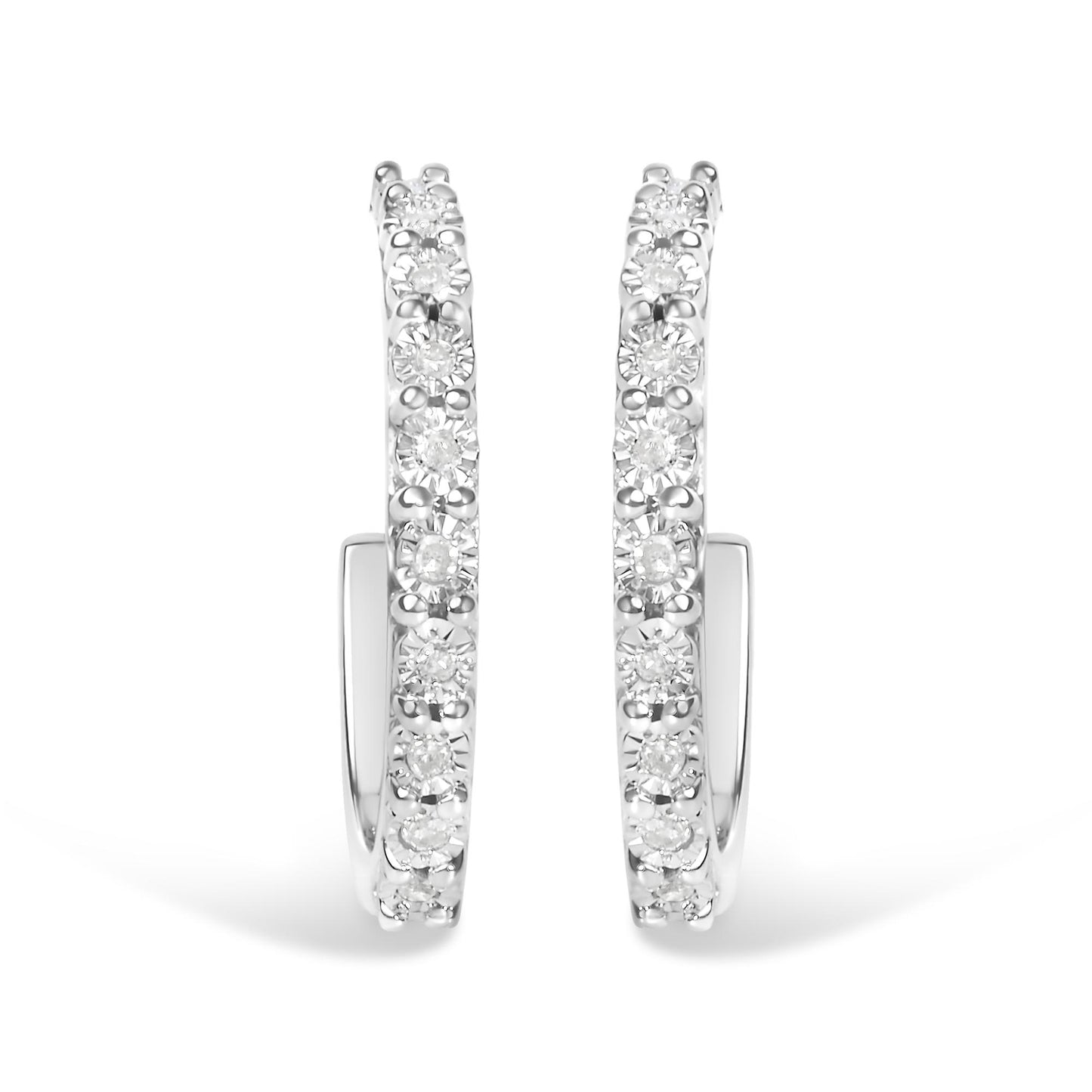 Front-facing close-up of white metal hoop earrings with round white gemstones set along the outer edge in a miracle setting.