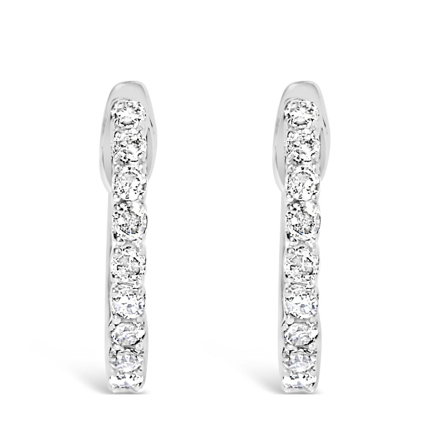 Front-facing view of white metal hoop earrings adorned with round white gemstones in a 4-prong setting along the outer edge.