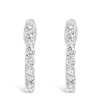 Front-facing view of white metal hoop earrings adorned with round white gemstones in a 4-prong setting along the outer edge.