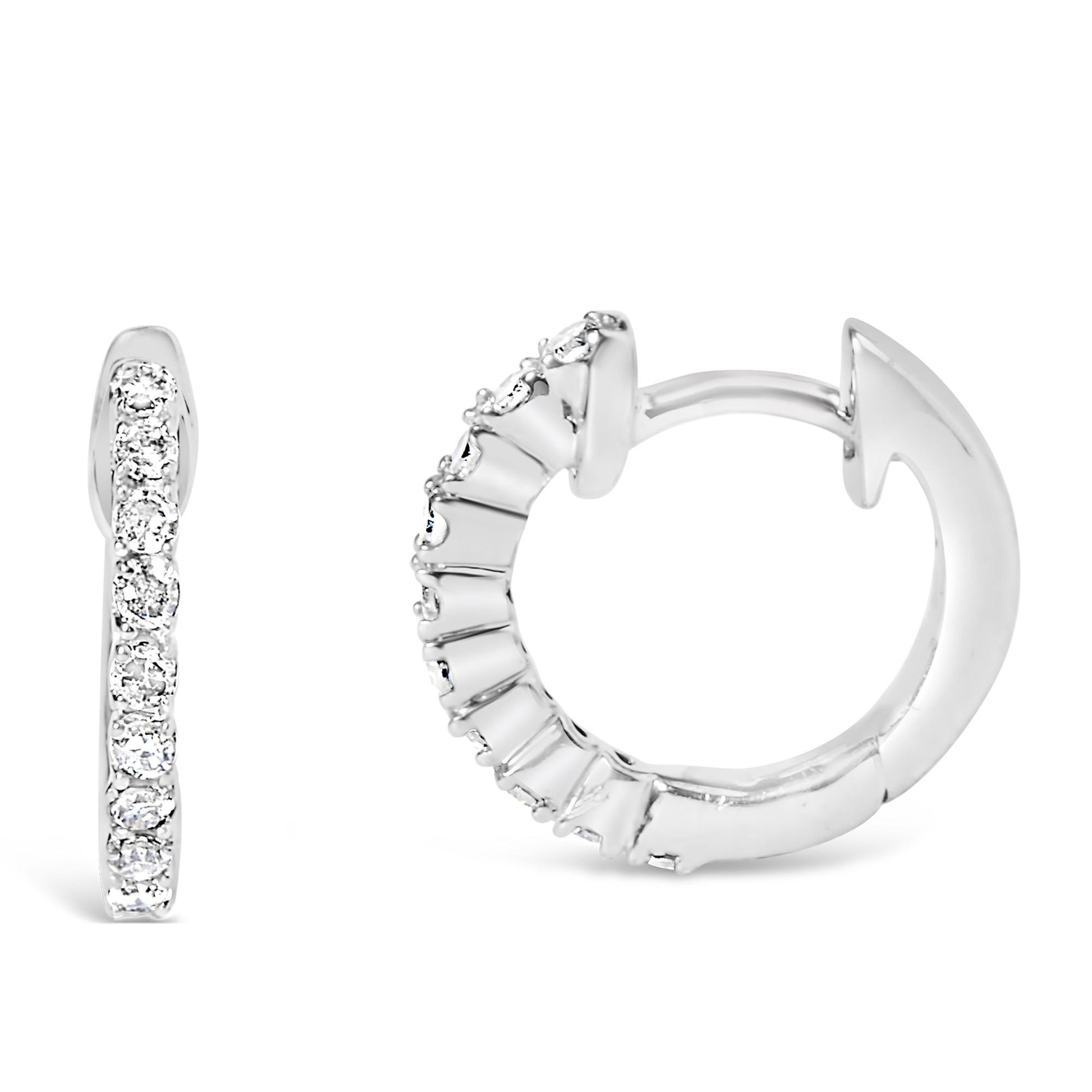 Close-up front and side views of a pair of white metal hoop earrings featuring multiple round white gemstones in 4-prong settings along the front half of each hoop.