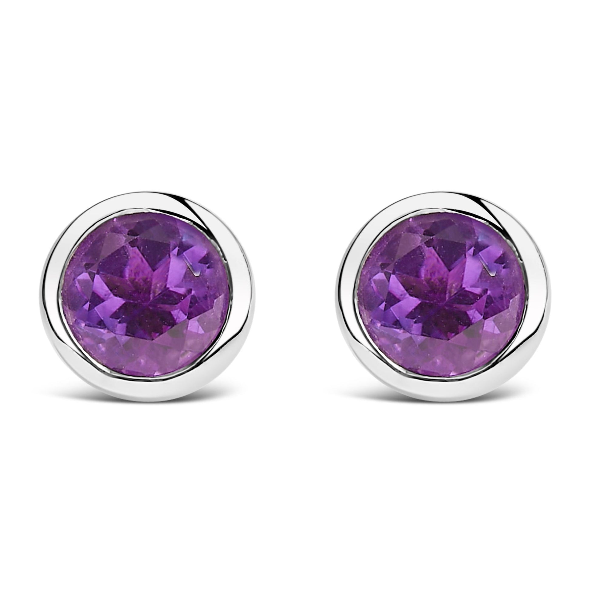 Front view of a pair of white metal stud earrings each featuring a round purple gemstone in a bezel setting.