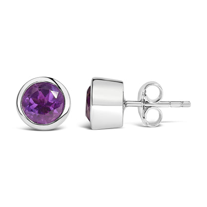Pair of white metal stud earrings with round purple gemstones in bezel settings, shown from front and side angles on a white background.