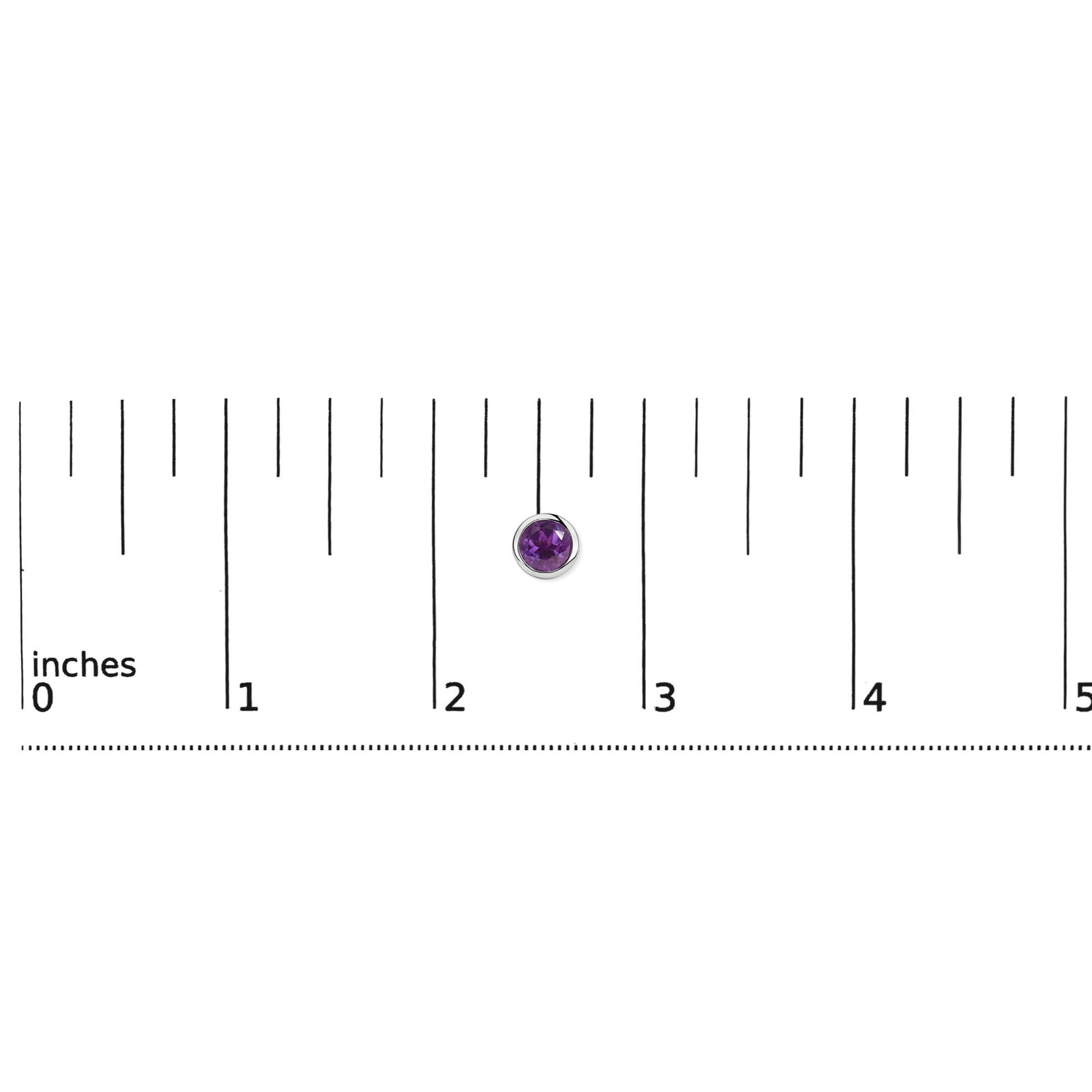 Close-up top view of a single round purple gemstone earring with a white metal bezel setting, shown on a ruler scale.