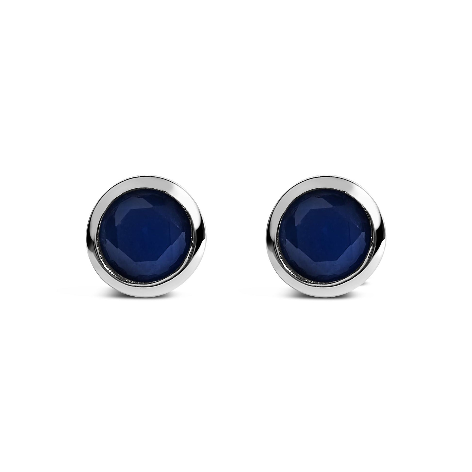 Pair of round blue gemstone stud earrings in a white metal bezel setting, shown from the front on a white background.