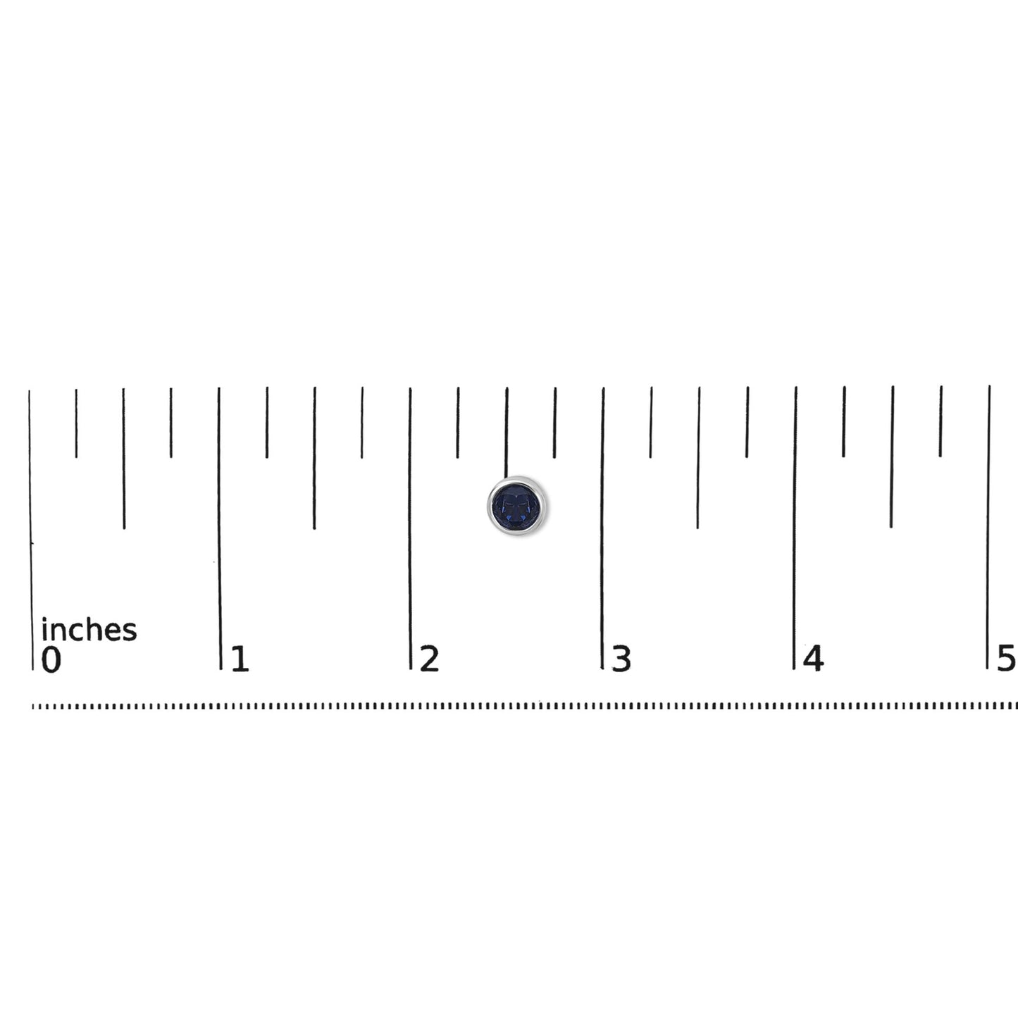 Close-up of a single round blue gemstone earring with a white metal bezel setting, shown flat on a ruler for scale.