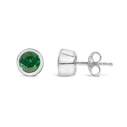 Pair of white metal stud earrings with round green gemstones in bezel settings, shown from front and side angles on a white background.
