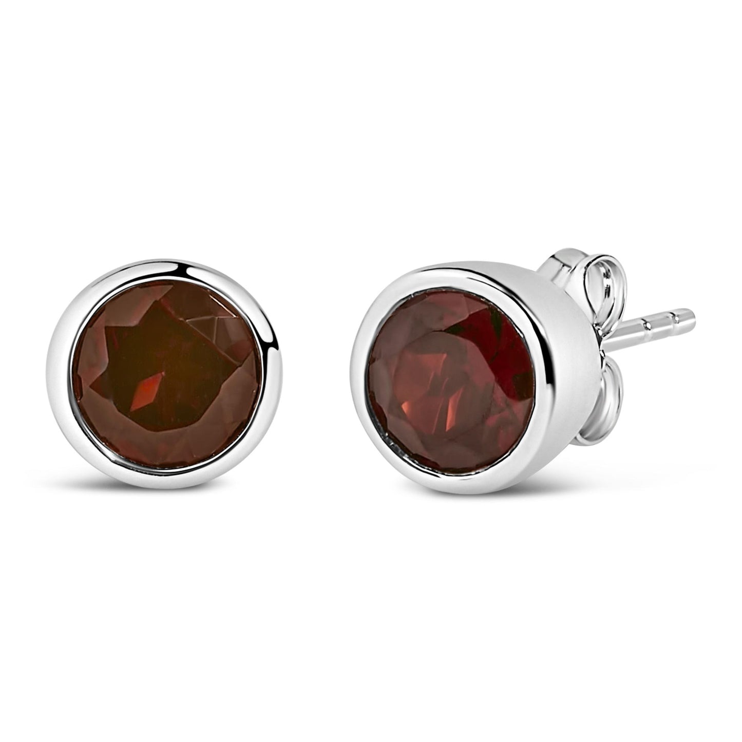 Close-up front and side angle of white metal stud earrings with round red gemstones in bezel settings.