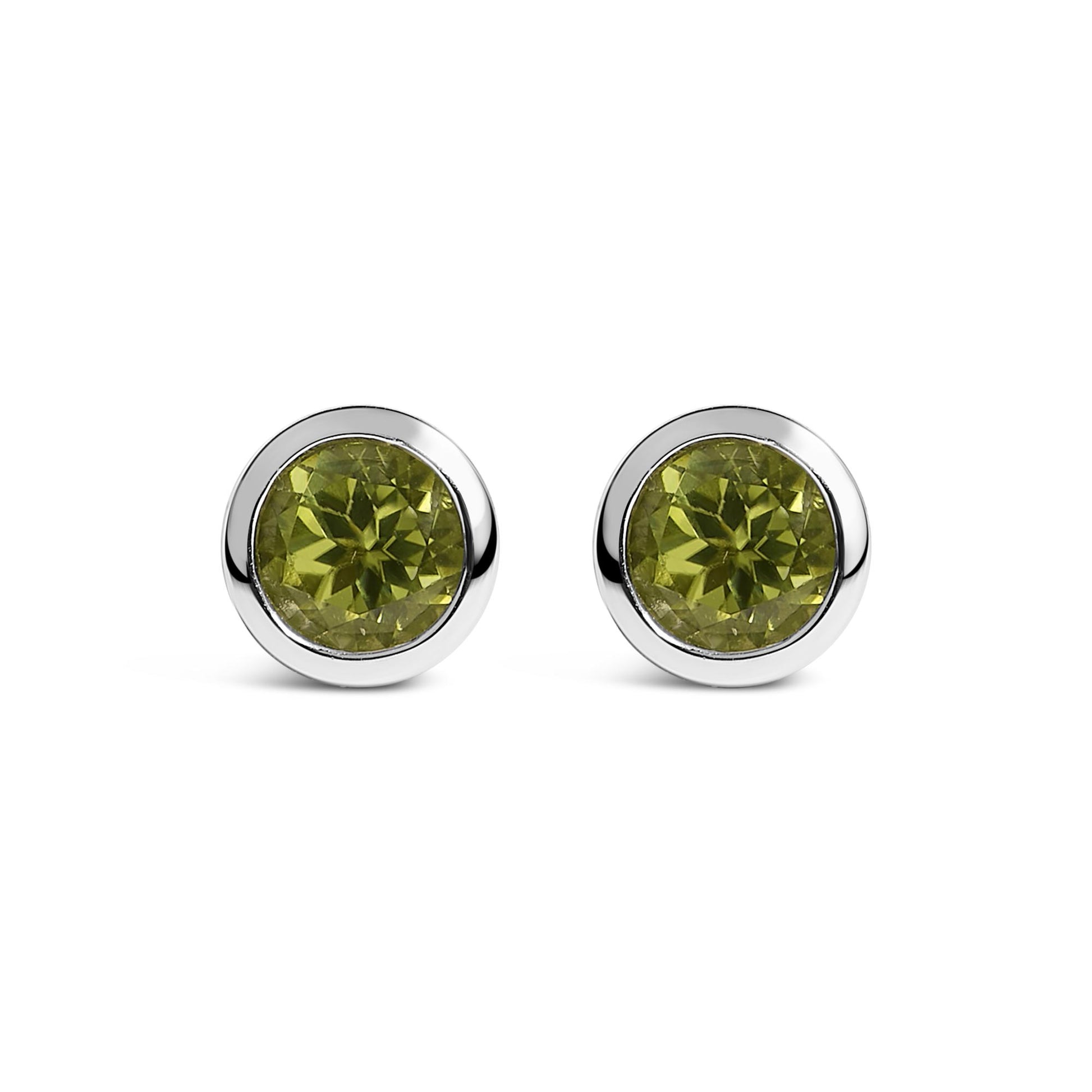 Pair of round white metal stud earrings with green round gemstones in bezel settings, shown from the front on a white background.