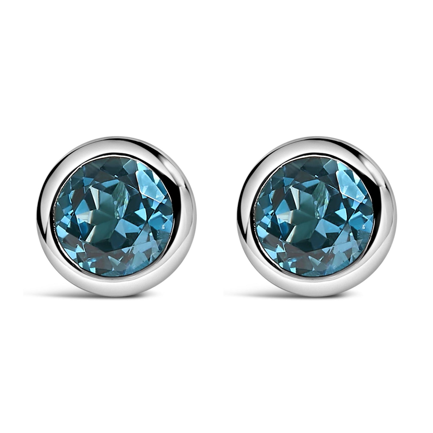 Pair of white metal round bezel-set earrings with round blue gemstones, shown in a front-facing angle.