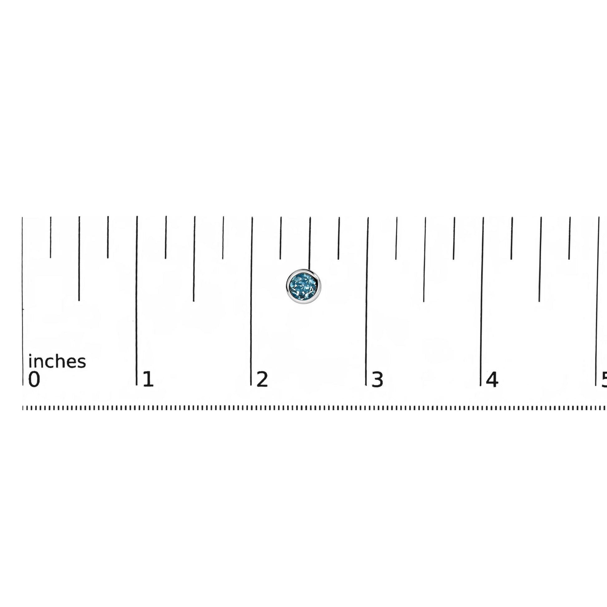 Close-up front view of a single white metal earring with a round blue gemstone in a bezel setting, shown on a ruler for scale.