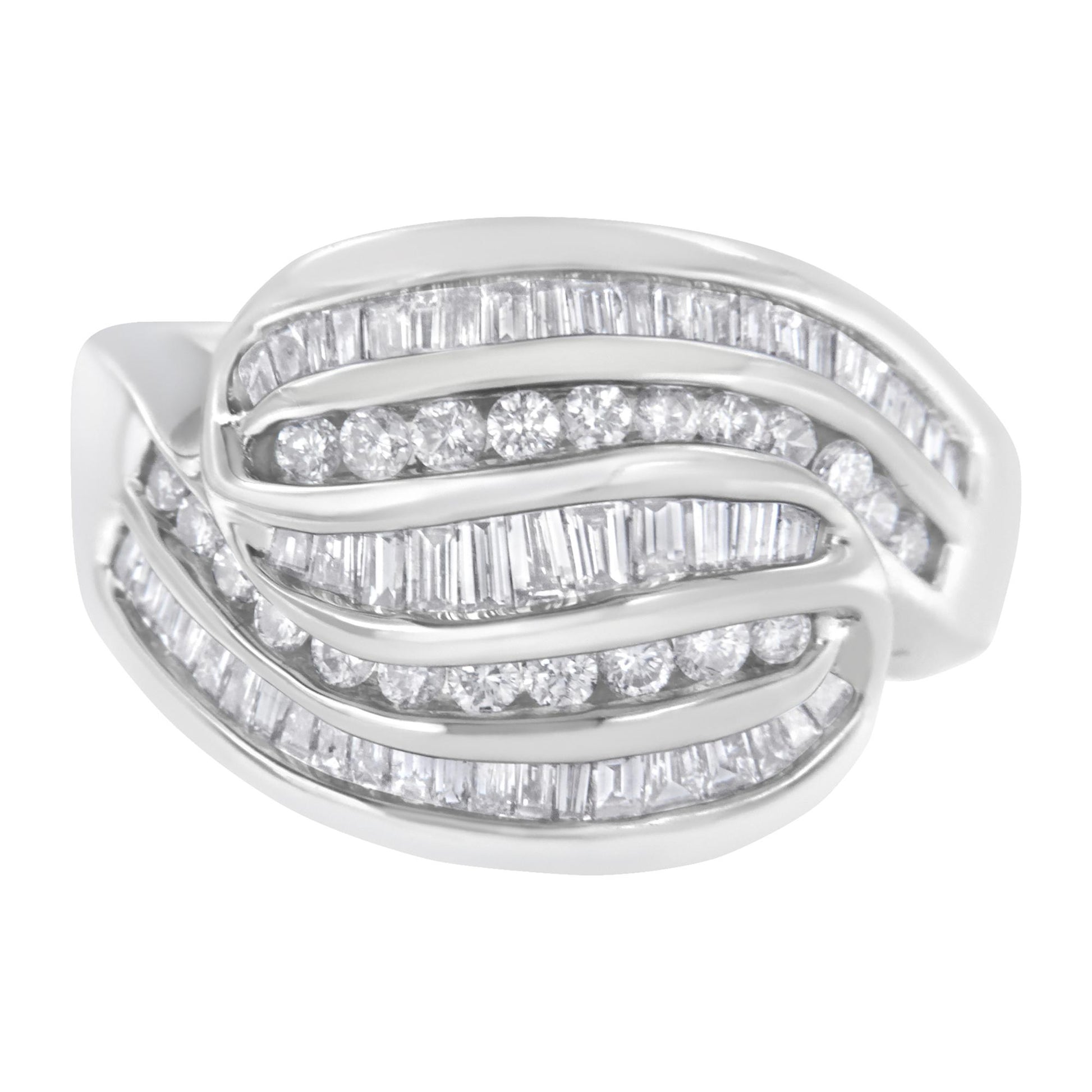 White metal ring with overlapping curved rows set with channel-set round and baguette white gemstones, shown in a close-up front angle.