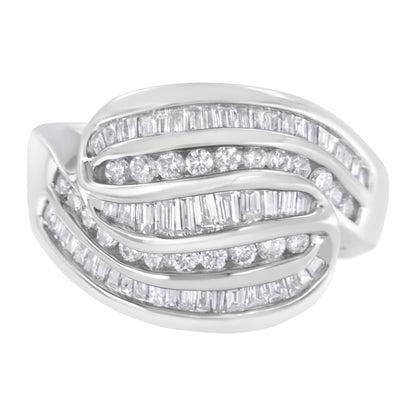 White metal ring with overlapping curved rows set with channel-set round and baguette white gemstones, shown in a close-up front angle.