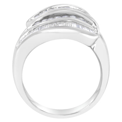 Front angle view of a white metal ring with two rows of channel-set white round gemstones and one row of channel-set white baguette gemstones.