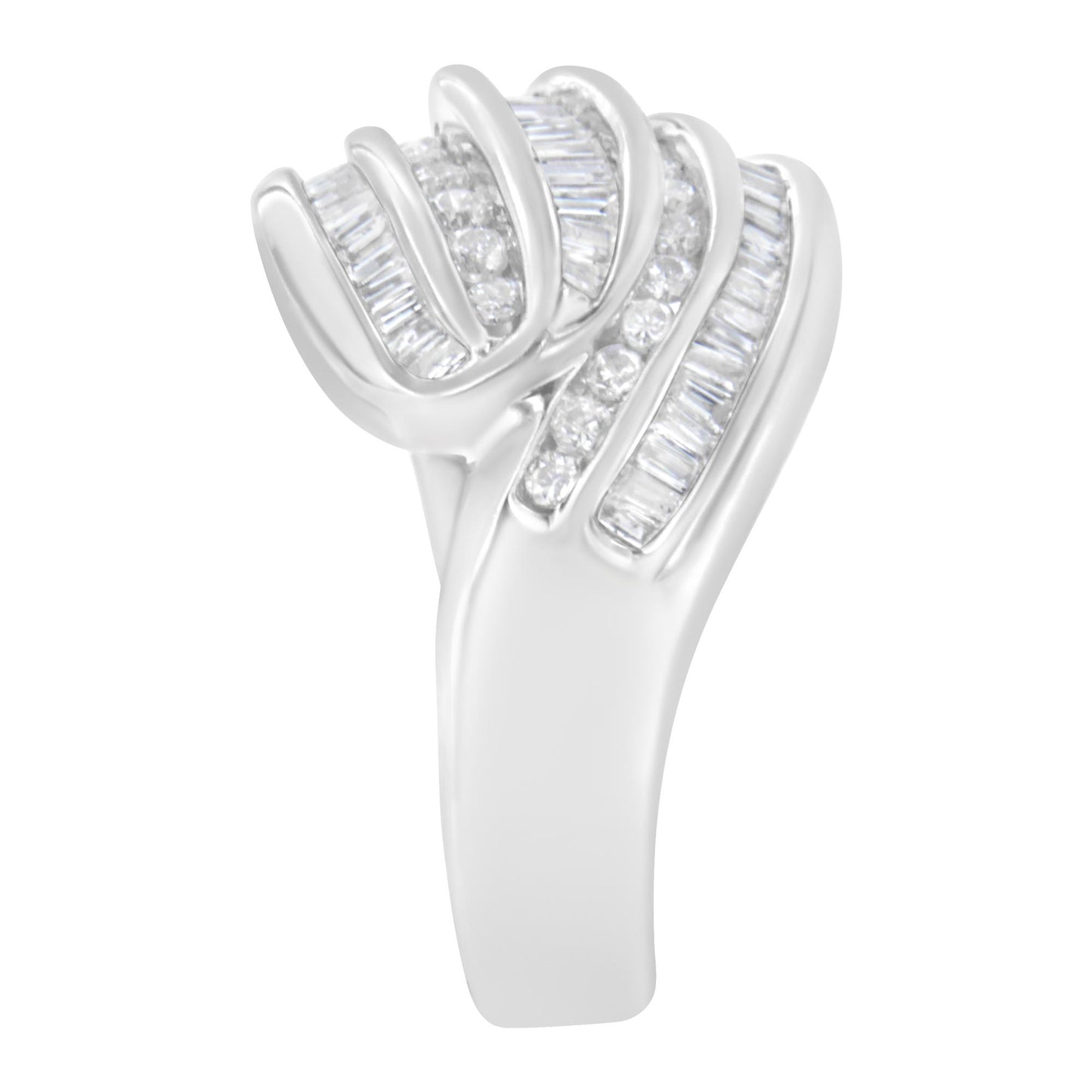 White metal ring with alternating rows of round and baguette channel-set white gemstones, shown from a side angle.