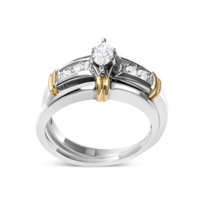 Front angle view of a two-toned ring featuring a marquise-shaped white gemstone in a prong setting and round white gemstones in a pave setting along the band.