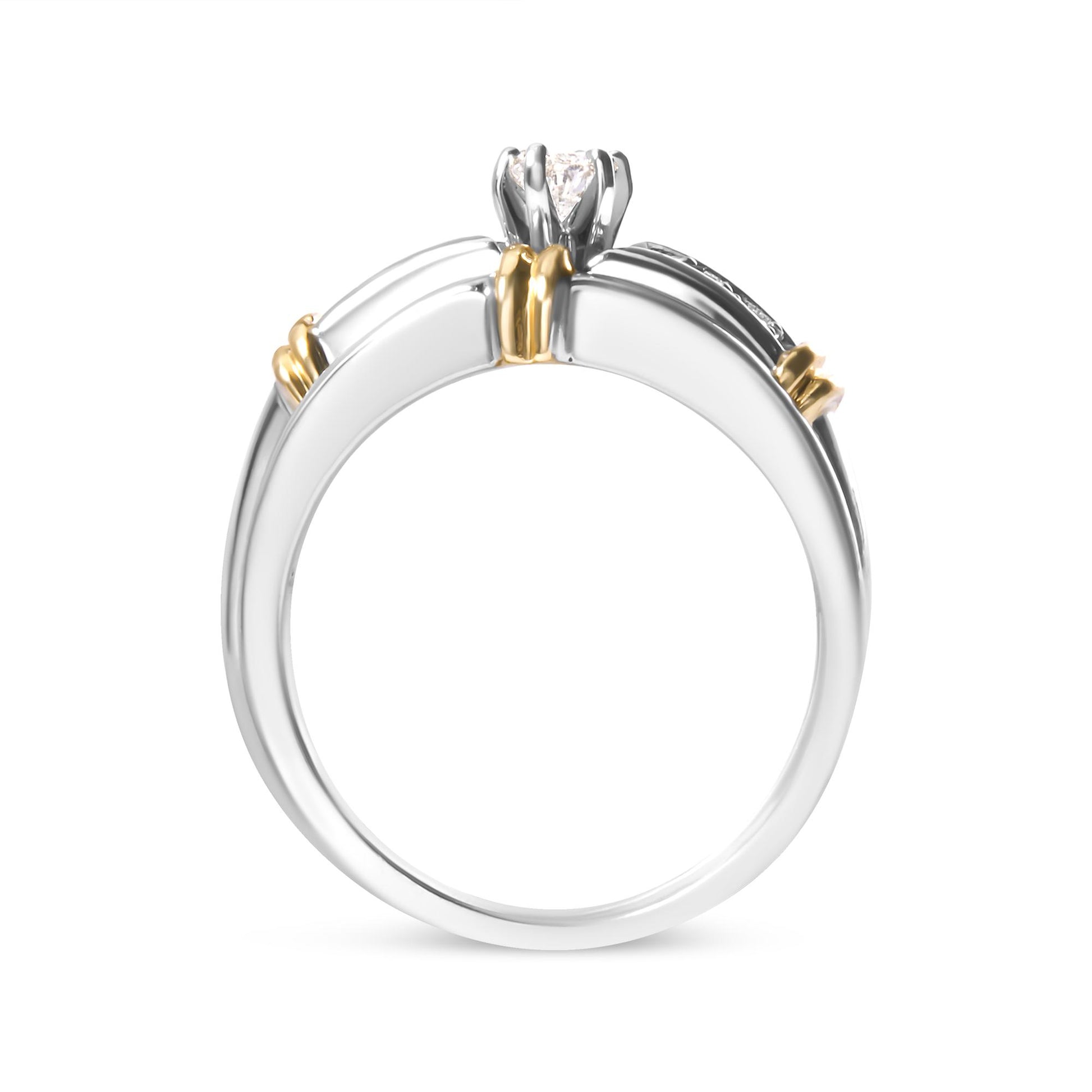 Two-toned ring with a marquise white gemstone in prong setting and round white gemstones in pave setting, shown from a side angle.
