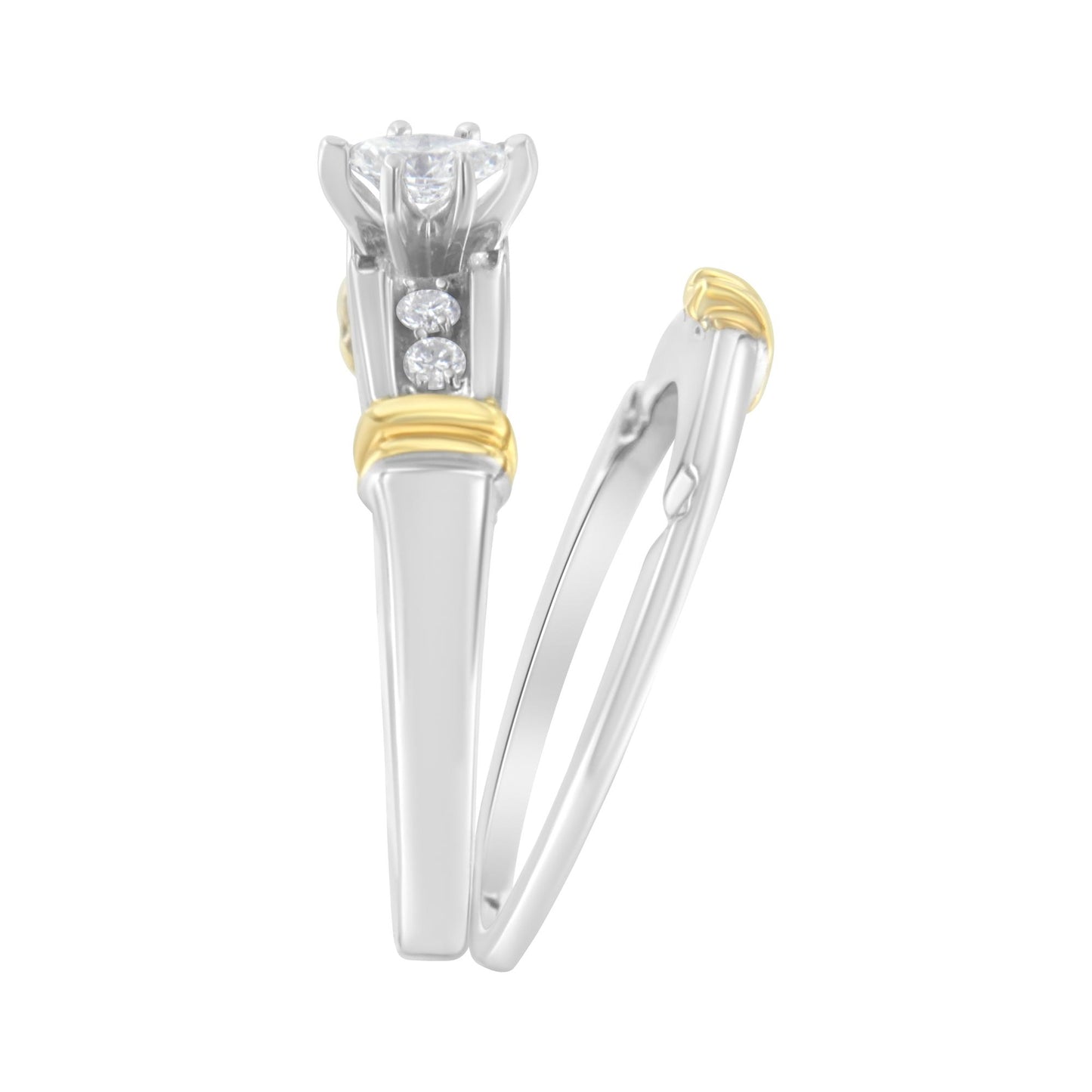 Close-up side view of a two-tone ring featuring a marquise-shaped white gemstone in a prong setting and round white gemstones in a pave setting, with yellow accents.