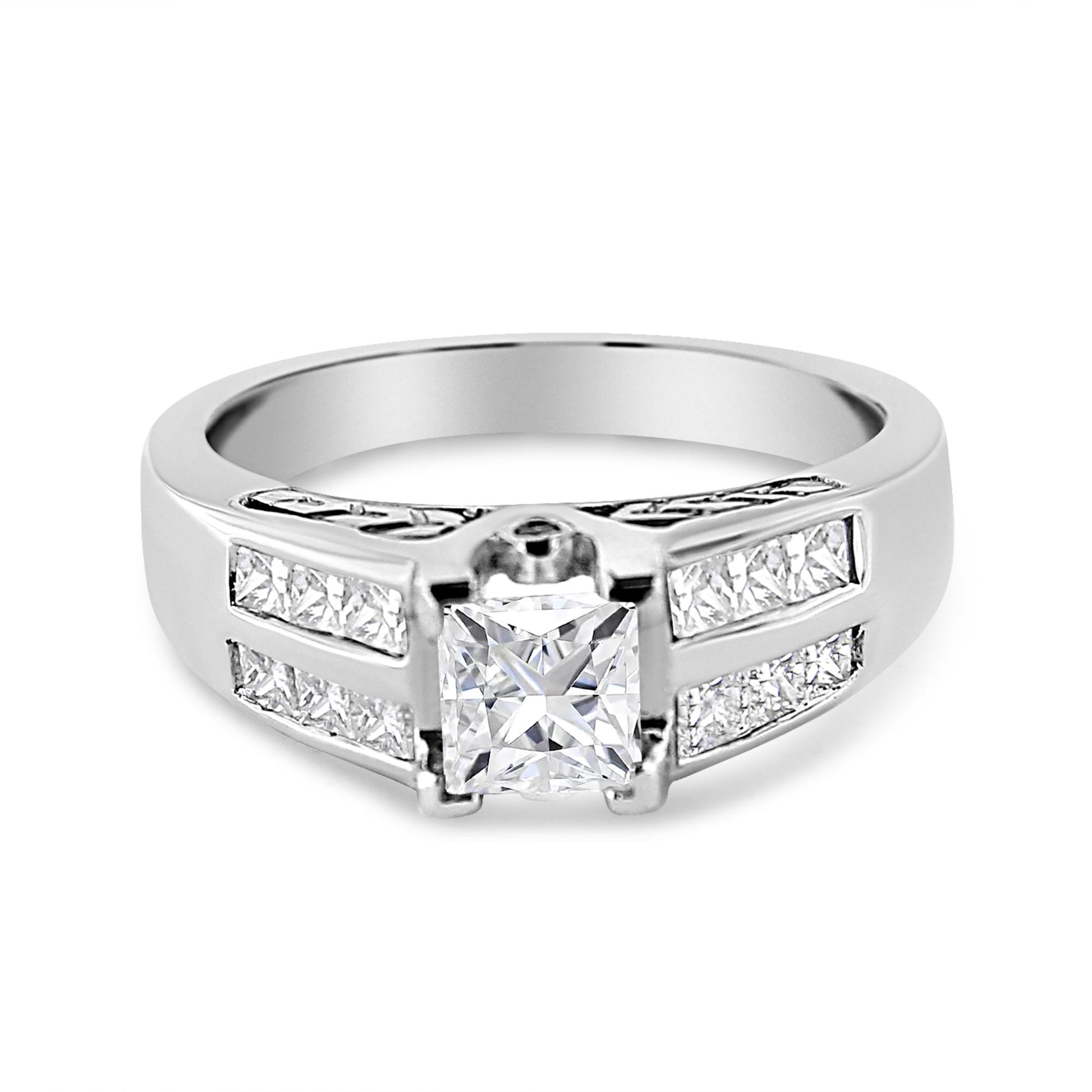 White metal ring with a princess-cut gemstone in the center with invisible setting, flanked by channel-set princess-cut gemstones on both sides, and round bezel-set white gemstones, front angle view.